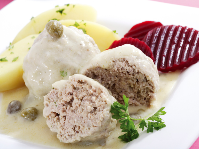 Originally a Prussian specialty, a königsberger klops is a veal meatball topped with capers and creamy gravy.