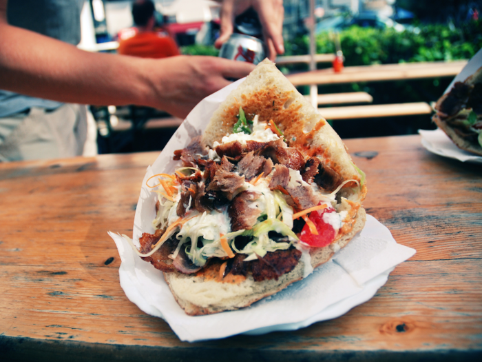 Although originally from Turkey, döner kebab is a common street food in Germany featuring a pita packed full of rotisserie meat, veggies, and plenty of sauce.