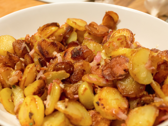 The German version of home fries, bratkartoffeln are cooked potato rounds mixed with bacon and onions.