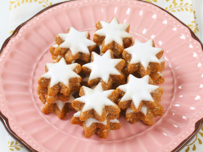 A popular German Christmas cookie, zimtsterne (cinnamon stars) taste faintly like gingerbread, and are made with almonds, cinnamon, ginger, and icing.