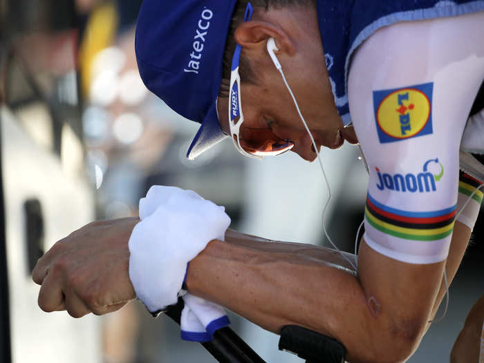 In addition to an ice vest, Tony Martin wore an ice wrap around his wrists to keep cool as he warmed up for his time trial.