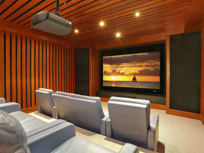 A wood-paneled movie theater is also hidden deep in the home.