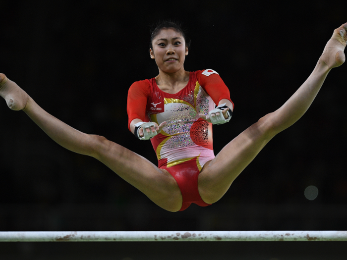 Yuki Uchiyama of Japan competes on the uneven bars.