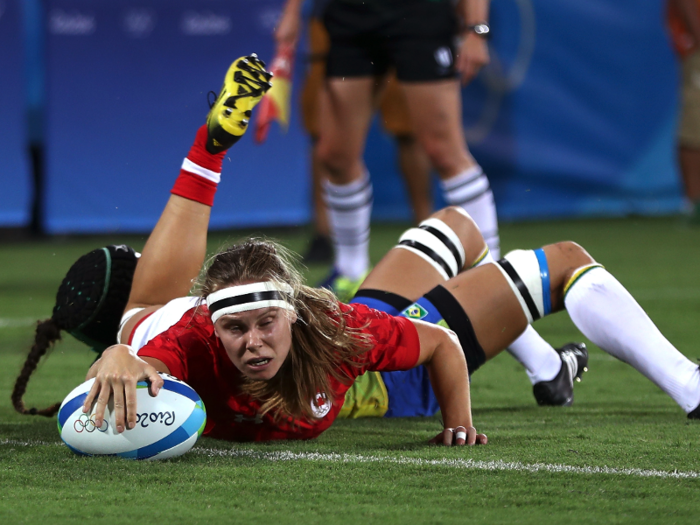 Canadian rugby player Karen Paquin scores in a game against Brazil.