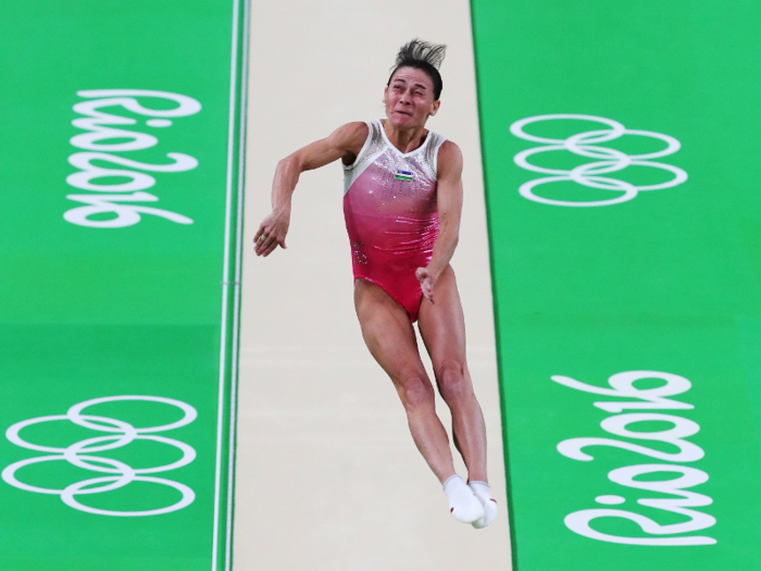 Oksana Chusovitina of Uzbekistan competes on the vault.