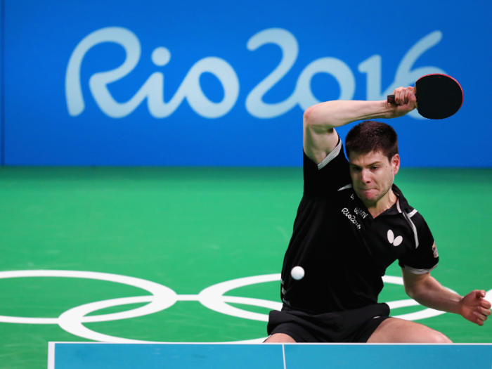 German table tennis player Dimitrij Ovtcharov volleys with Qatar