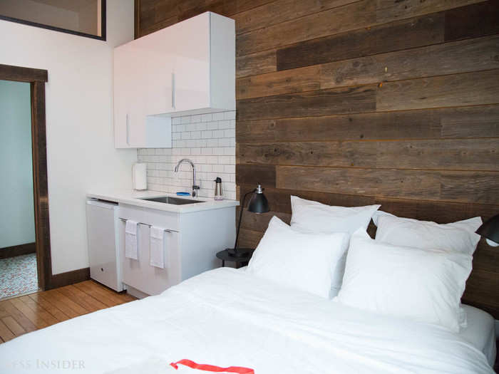 Some bedrooms include a kitchenette with a sink, mini-fridge, and storage space. That