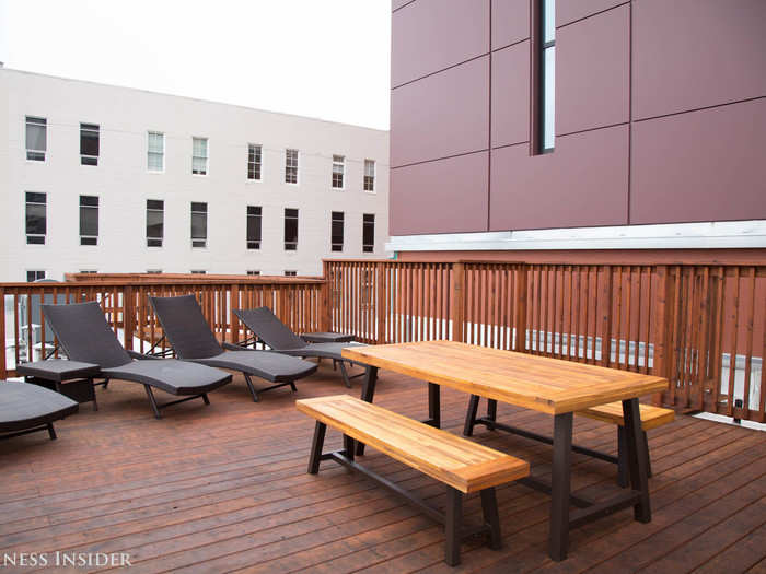 Rooftop access gives tenants a private place to sunbathe and space to grill a rack of ribs (through the grill is a little small for feeding a community this big).