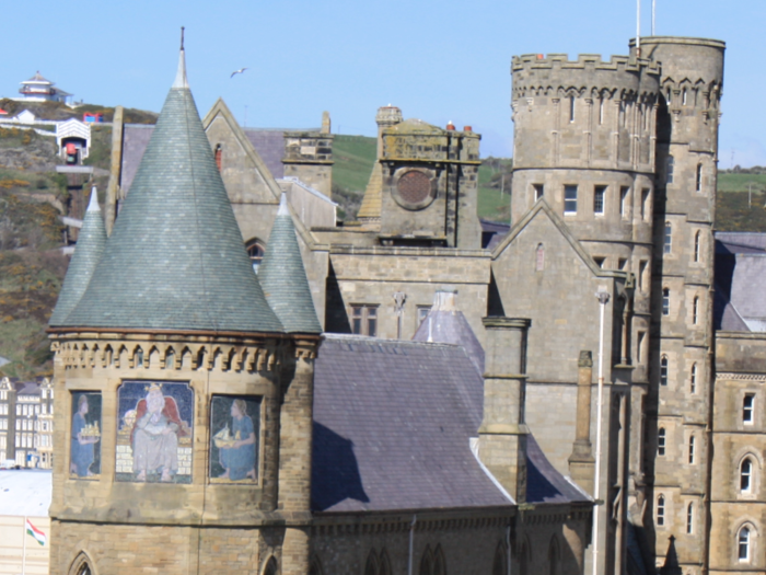 8. The Old University Building at Aberystwyth University in Wales is designed to look like a medieval castle, perfect for curling up with a history book.