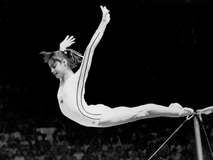 Nadia Comaneci wore a humble white leo with thin stripes when she scored her historic perfect 10 on uneven bars in 1976.