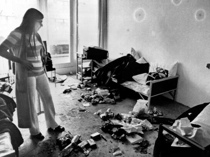 Munich, 1972: The games of 1972 had a dark shadow cast over them after 11 Israeli athletes were murdered in their accommodation by Palestinian terrorists. This photo shows Ankie Spitzer, widow of the Israeli fencing coach, Andre Spitzer, surveying the room where the incident occurred at Munich