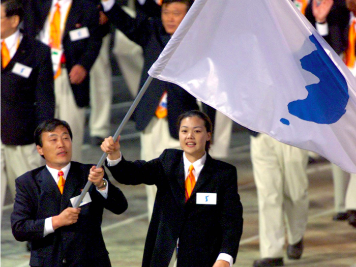 Sydney, 2000: For the first time in Olympic history, North and South Korea walked together in the opening ceremony as a show of solidarity. They waved a flag showing a blue silhouette of Korea as opposed to their respective national flags.