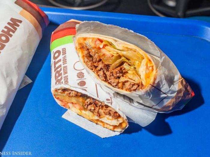 The Whopperrito is, on paper, a burrito with Whopper ingredients and some spices thrown in; a mythical hybrid that should never exist. A chimera of quick-service restaurants; the most unholy of menu marriages. Cutting in, however, it actually appears... appetizing.