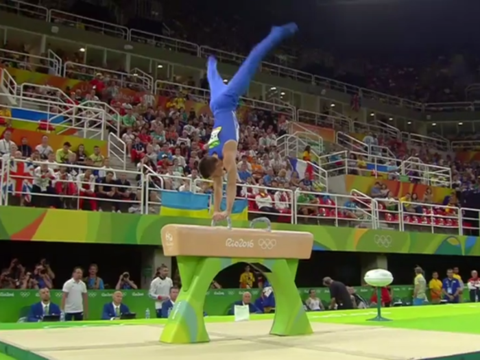 Whitlock began smoothly in the pommel horse with a handstand.