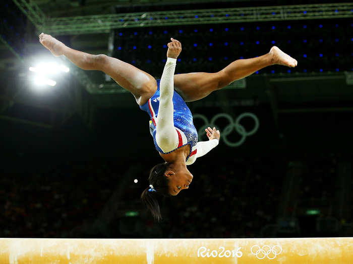 Spinning gymnasts take advantage of something called angular momentum, which is how an object spins around an axis. When gymnasts pull their arms and legs tightly together, it causes them to spin faster.