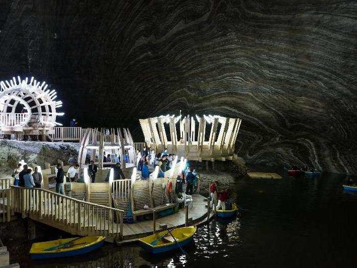 This 400-foot-deep amusement park was constructed in a former salt mine in Romania, called the Salina Turda. Inside, you can ride an underground ferris wheel, paddle in a lake, play ping pong, and see performances at an amphitheater.