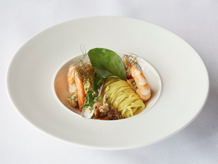 SIGNATURE DISH — Warm fruits of the sea, linguini, and shellfish cooking juices