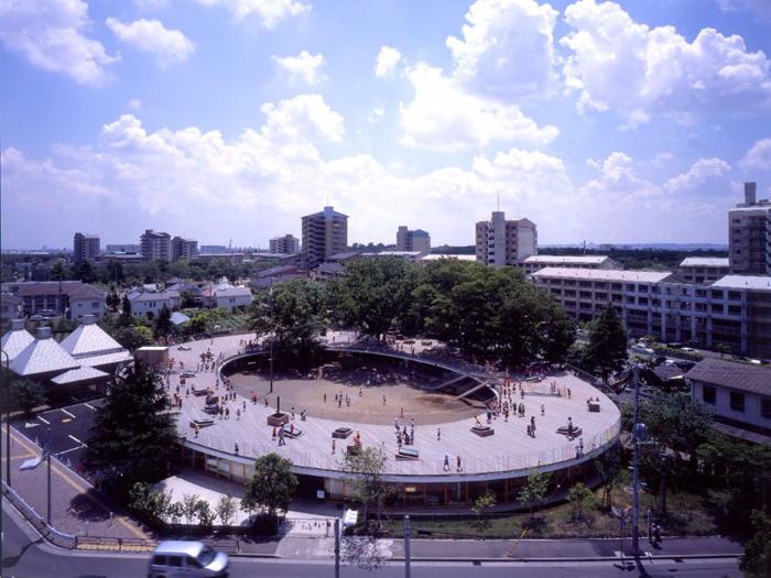 Fuji Kindergarten in Tachikawa, Japan, was built in 2007 as a complete circle. It encourages kids to run around on a rooftop boardwalk, climb nearby trees, fall down, and move freely between doorless rooms.