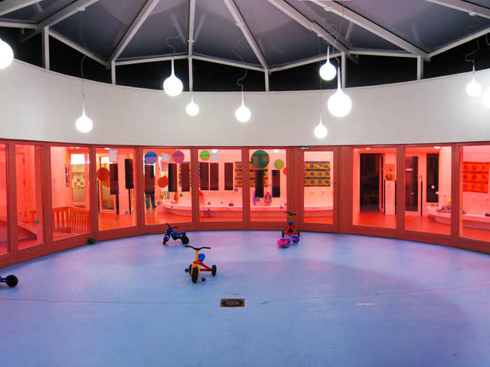 Sarreguemines Nursery, located in Sarreguemines, France, was designed like a human cell with the nursery in the center as the nucleus. Gardens surround the structure like cytoplasm, and an all-pink interior offers a calming place to play.