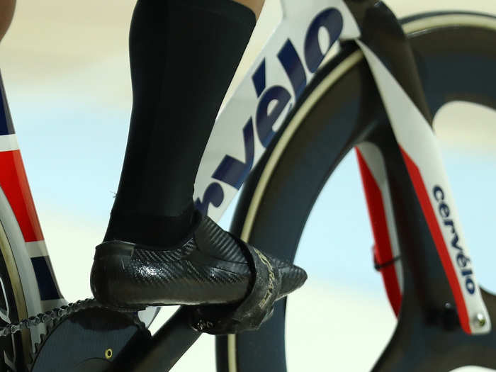 Most track sprinters used some sort of toe strap to keep their shoes clipped in tight and transfer maximum power to the pedals.