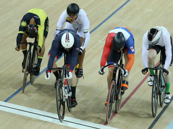 The races often come down to a bike throw: Here Gold medalist Jason Kenny of Great Britain, silver medalist Matthijs Buchli of the Netherlands, and bronze medalist Azizulhasni Awang of Malaysia cross the finish line in the men