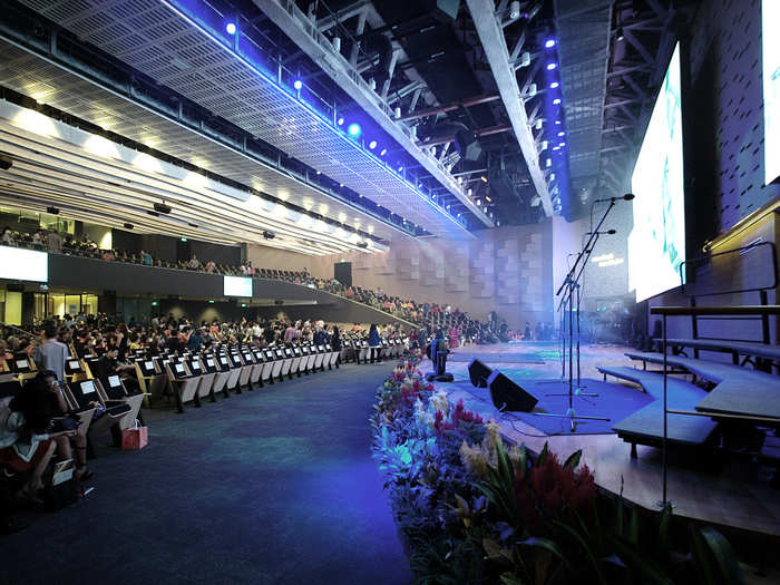 Sermons are held in a spacious room that looks more like an auditorium than a cathedral. Preachers here are no longer hidden behind a pulpit, but at an open mic.