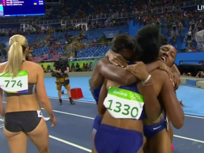 US sprinters Brianna Rollins, Nia Ali, and Kristi Castlin embraced when they realized they