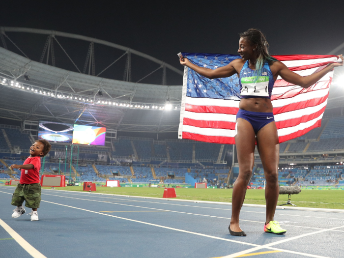 Nia Ali celebrates with her son Titus on the track after snagging the silver medal in the women