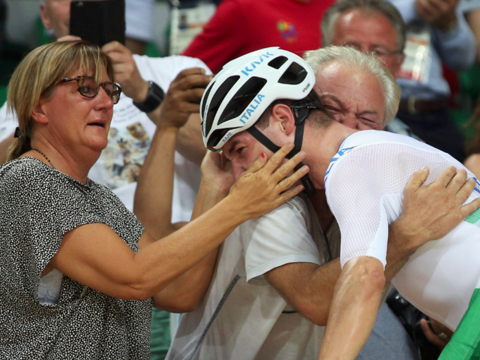 Elia Viviani, of Italy, celebrates his gold medal in men