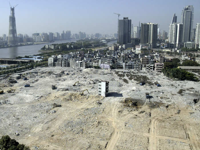 The last house in this area of Guangzhou stands in the middle of a construction site where an apartment complex will be built.