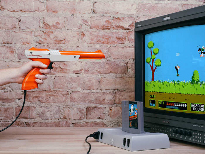 It also works with every classic NES peripheral, from the Zapper seen below to that ridiculous "Track & Field" mat you