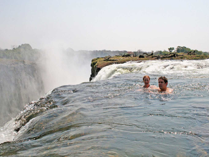 Swim at the edge of a cliff at the Devil’s Pool, a natural infinity pool in Victoria Falls, which borders Zambia and Zimbabwe.