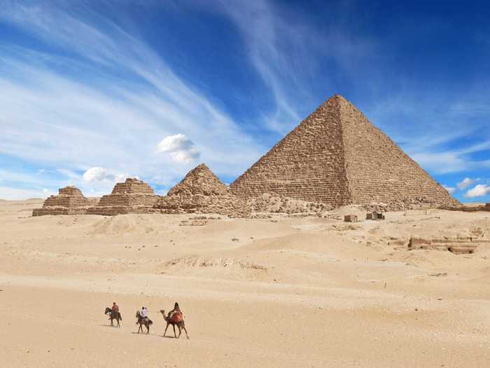 Visit the Great Pyramids of Giza in Egypt, the only one of the seven ancient wonders of the world still in existence.