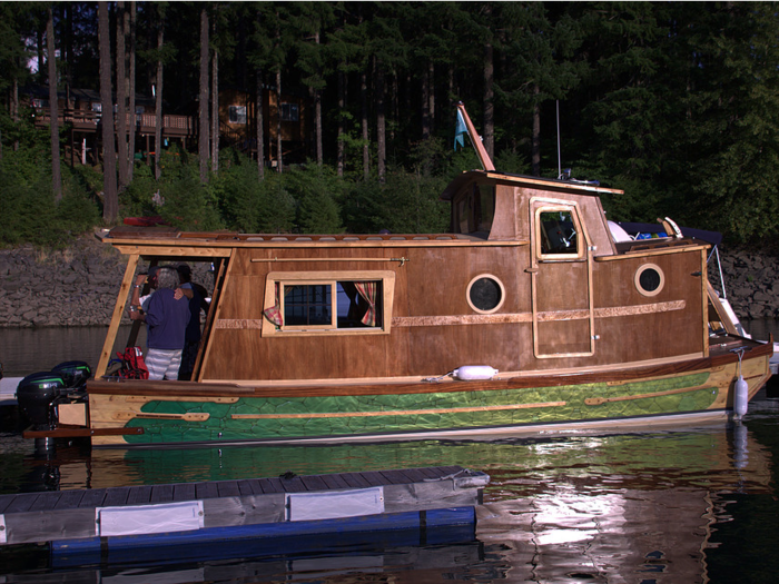 The tiny houseboat can fit eight people at a time, though it only sleeps around four.