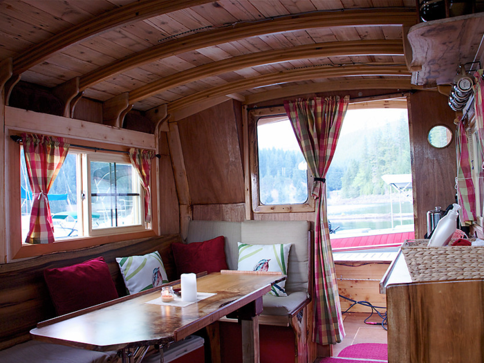 The houseboat is compact, yet has all the components of a normal home.