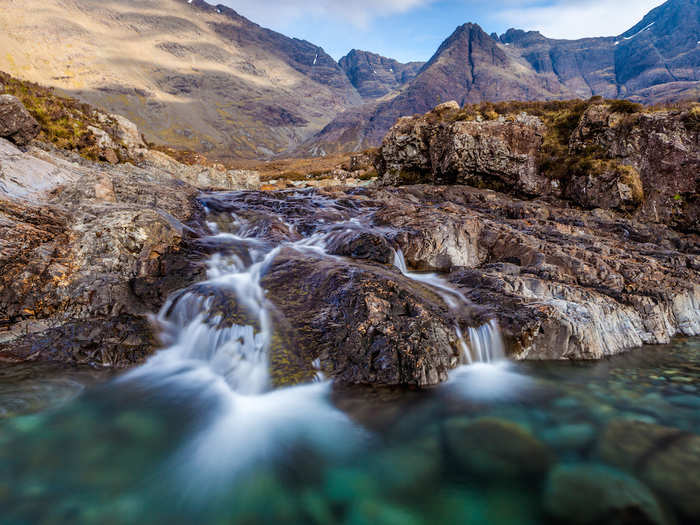 26. Swim beside waterfalls in beautifully clear water at the Fairy Pools in the village of Carbost on Scotland