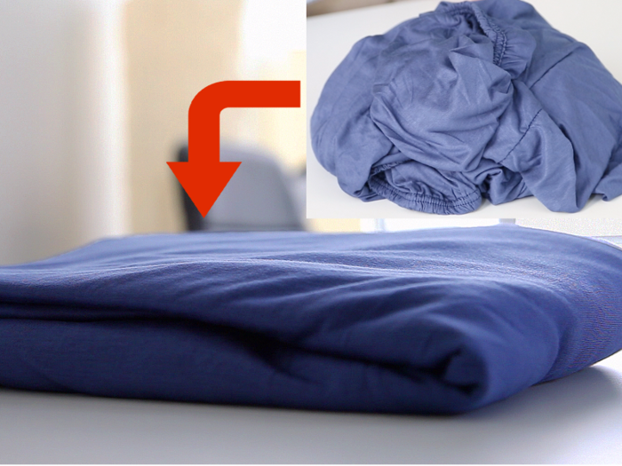 Fold a fitted sheet neatly with this tried and true technique.