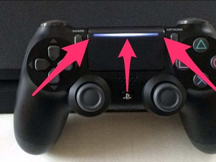 2) The gamepad is slightly different — you can see the light from the front of the controller through the touchpad. Like this: