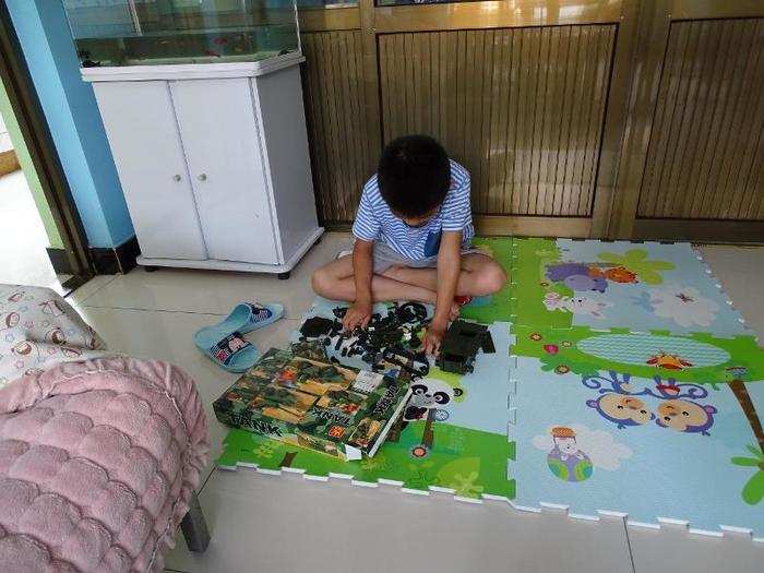 In a Chinese home living on $2,235/month per adult, the favorite toy is a military tank model.