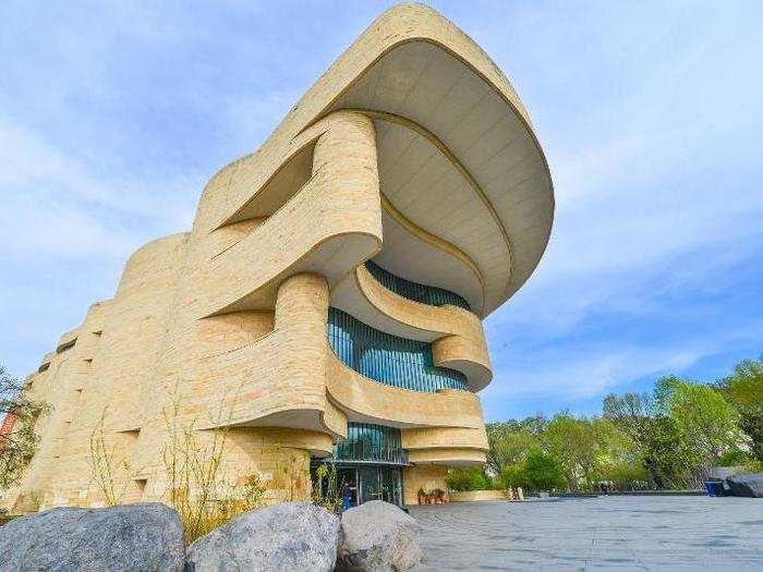 Washington, DC is known for its Neoclassical-style museums, but the National Museum of the American Indian looks like a rock formation smoothed by the elements.