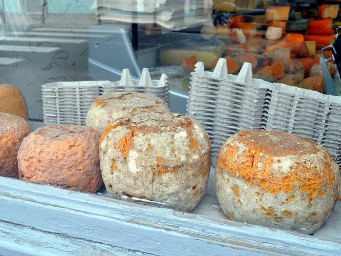 FRANCE: Mimolette cheese has a grayish exterior color, which is the result of cheese mites intentionally added to the cheese