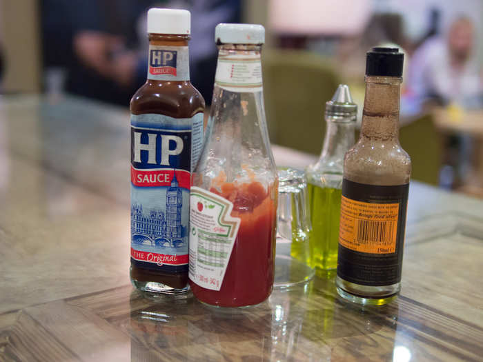 Brits have been adding brown sauce to bacon sandwiches and breakfasts for centuries. It is made with malt vinegar, tomatoes, dates, tamarind extract, and spices.