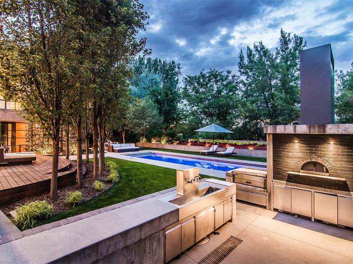 The house also has an outdoor kitchen, complete with a wood-fired pizza oven.