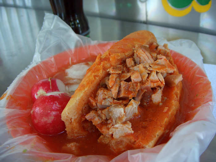 Torta ahogada is a pork (or chicken) sandwich "drowned" in a dried chili pepper sauce, though you can make it less spicy with a tomato-based sauce.