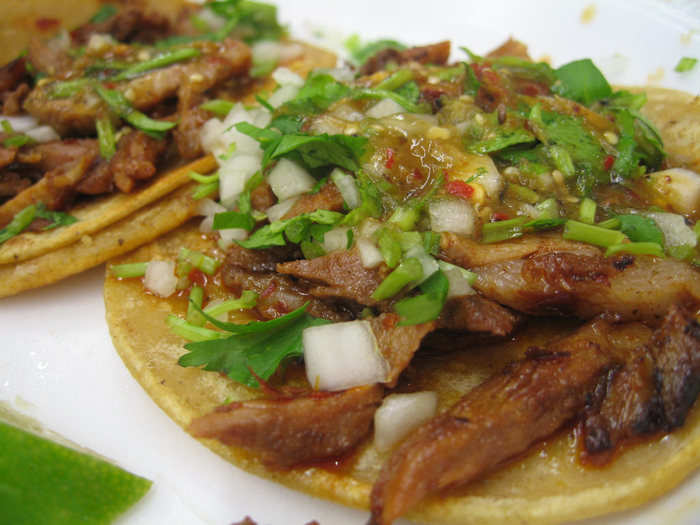 Tacos al pastor feature marinated pork that