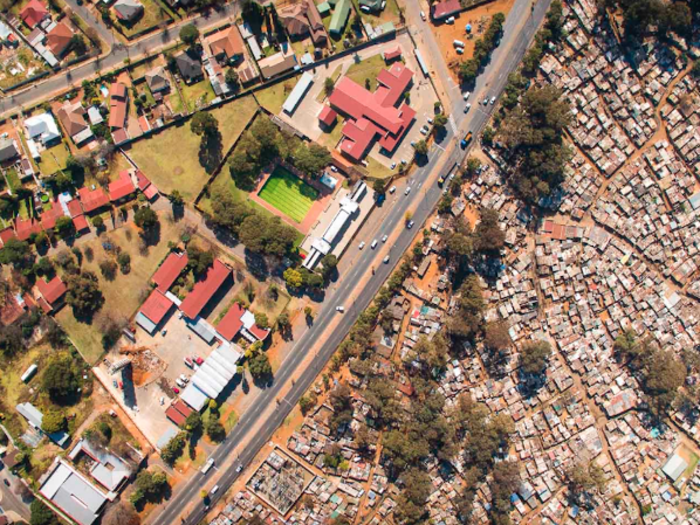 Only aerial photography could capture the difference in density between the slums and the affluent neighborhoods.