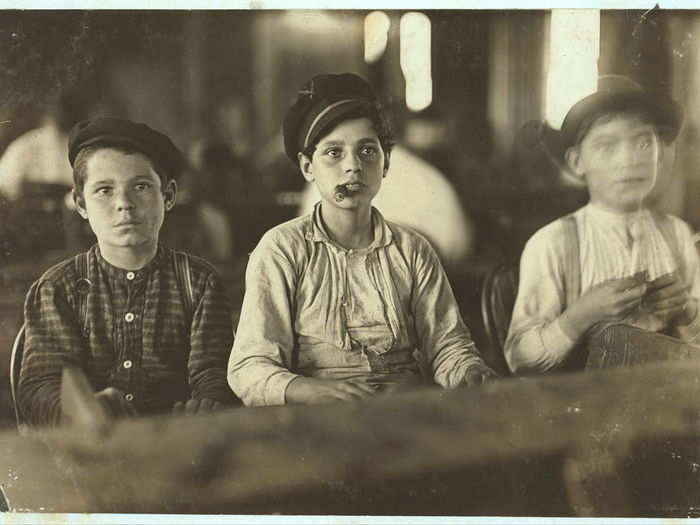 Young cigarmakers at Englahardt & Co., Tampa, Florida. These boys looked under 14. Work was slack and youngsters were not being employed much. Youngsters all smoke. Witness Sara R. Hine. Taken January 1909.