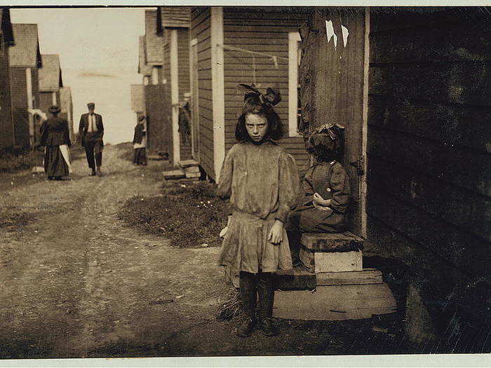 Nan de Gallant, 4 Clark Street, Eastport, Maine, a 9-year-old cartoner, Seacoast Canning Co., Factory No. 2. Packs some with her mother. Mother and two sisters work in factory. One sister has made $7 in one day. During the rush season, the women begin work at 7 a.m., and at times work until midnight. Brother works on boats. The family comes from Perry, Maine, just for the summer months. Work is very irregular. Nan is already a spoiled child. Location: Eastport, Maine, August 1911.