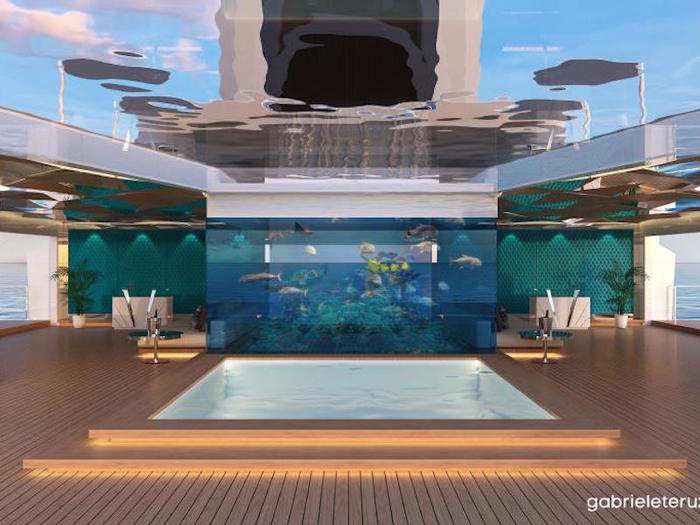 Further inside the yacht is a beach club with a large aquarium in the middle. It has a glass ceiling so you can peer above, and there