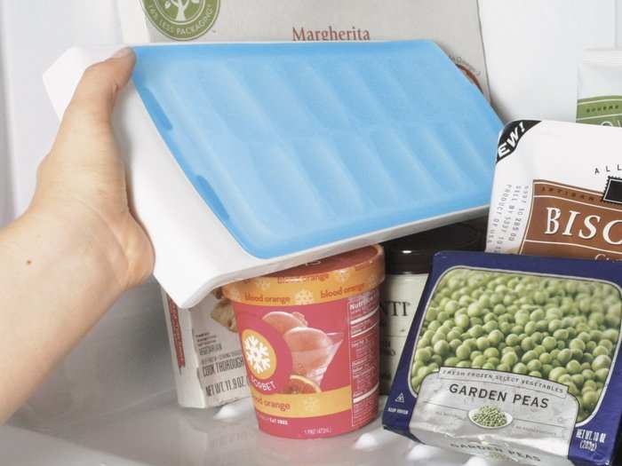 A lid to keep ice trays from spilling.